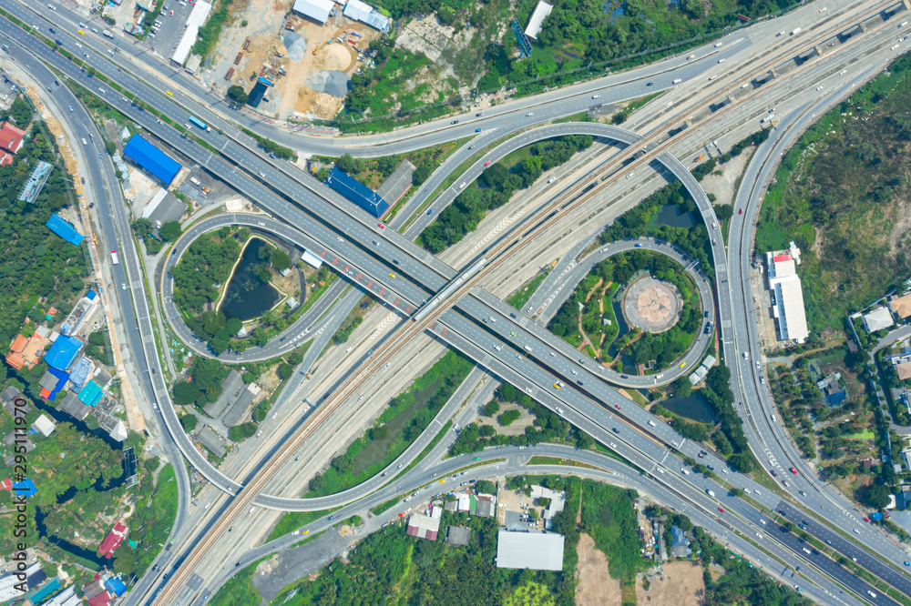 Rail track and conductor rail top view, Road Expressway traffic an important infrastructure with moving cars and railway tracks on which the train rides in Bangkok Thailand. Rail track and conductor rail top view, Road Expressway traffic an important infrastructure with moving cars and railway tracks on which the train rides in Bangkok Thailand.