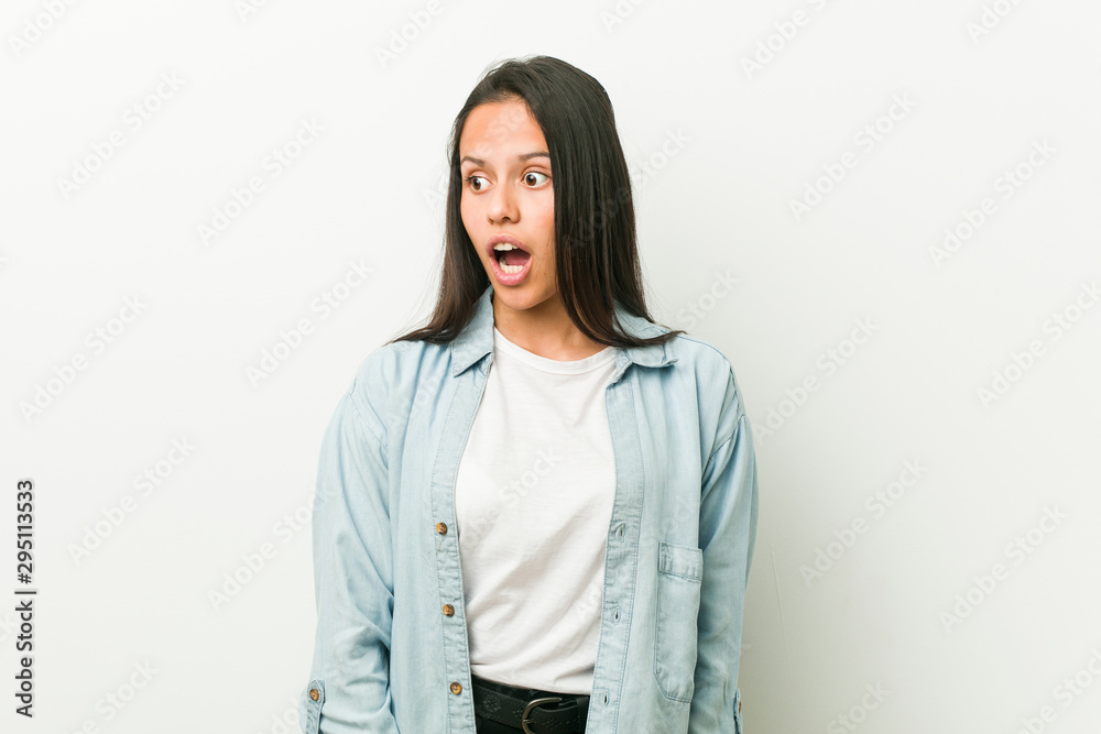 Young hispanic woman being shocked because of something she has seen. Young hispanic woman being shocked because of something she has seen.