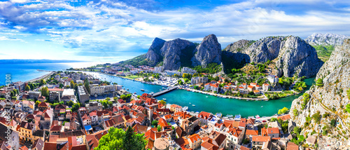 Landmarks of Croatia - impressive Omis town surrounded with gorges, over Cetina river photo