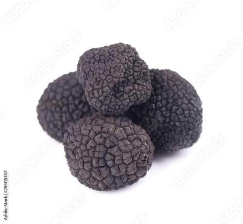 Black truffles isolated on a white background. Delicacy exclusive truffle mushroom. Piquant and fragrant French delicacy. Clipping path.