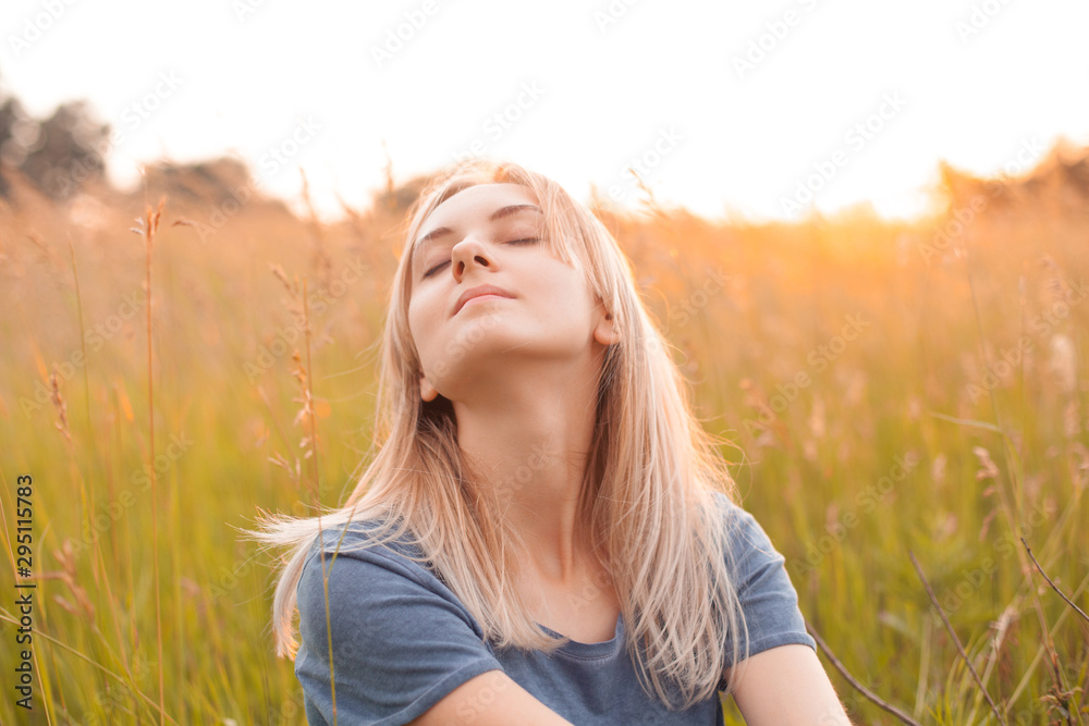 Portrait of a woman with beautiful blonde hair. Eyes closed Portrait of a woman with beautiful blonde hair. Eyes closed