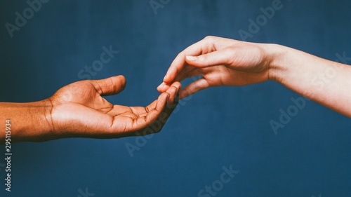 Romantic international relationship. Love care harmony. Interracial couple gentle fingertip touch. photo