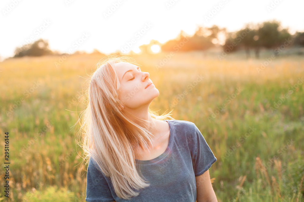Young woman spend time outdoors at sunset Young woman spend time outdoors at sunset