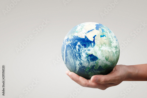 Globe  earth in hand  holding our planet glowing. Earth image provided by Nasa