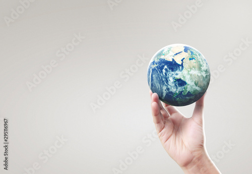 Globe  earth in hand  holding our planet glowing. Earth image provided by Nasa