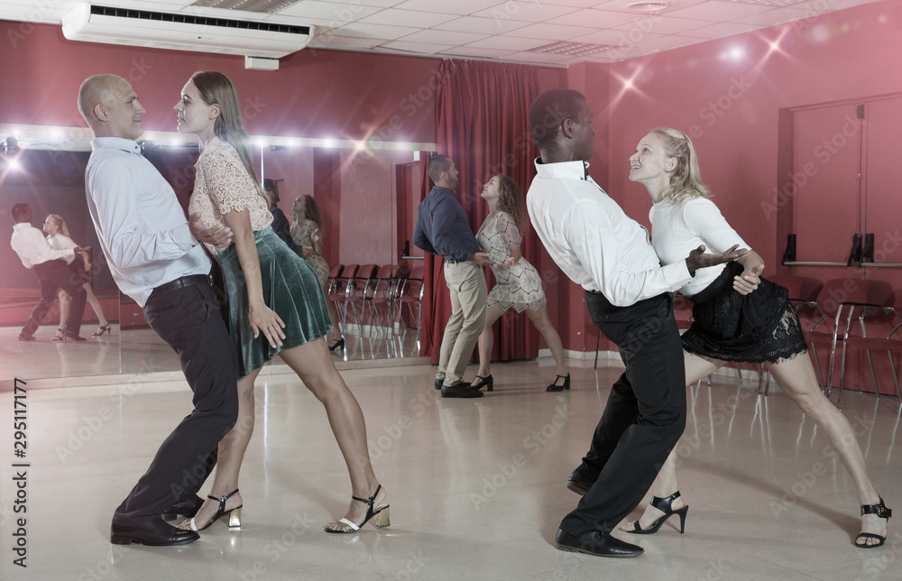 People dancing rock-and-roll in pairs Stock Photo | Adobe Stock