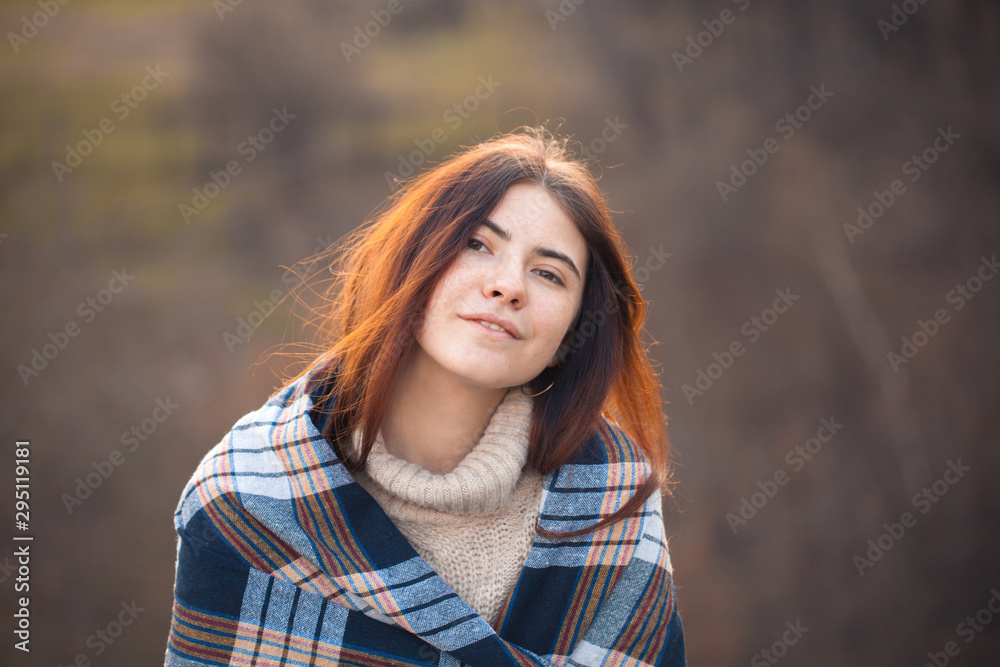 Portrait of beautiful young woman outdoors