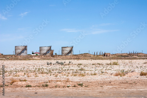 Storage of extracted oil at production sites. Big Industrial oil tanks in petroleum storage terminal. Azerbaijan