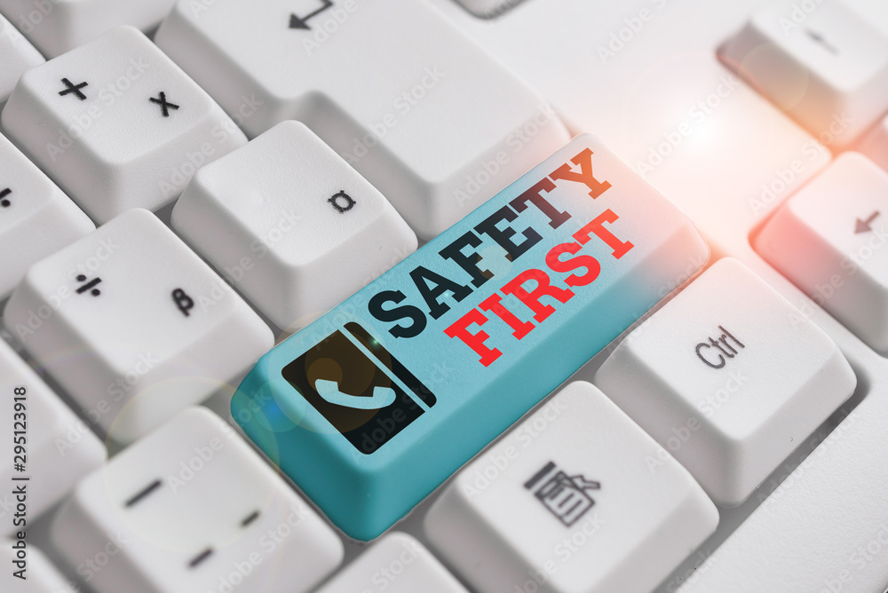 Text sign showing Safety First. Business photo text said to mean that it is best to avoid any unnecessary risks White pc keyboard with empty note paper above white background key copy space Text sign showing Safety First. Business photo text said to mean that it is best to avoid any unnecessary risks White pc keyboard with empty note paper above white background key copy space