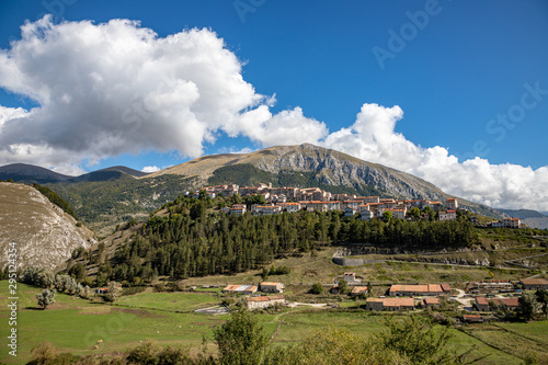 Landscape of the village of Opi and the Marsicano Moun with cloud in background. Abruzzo, Lazio and Molise National Park, Italy photo