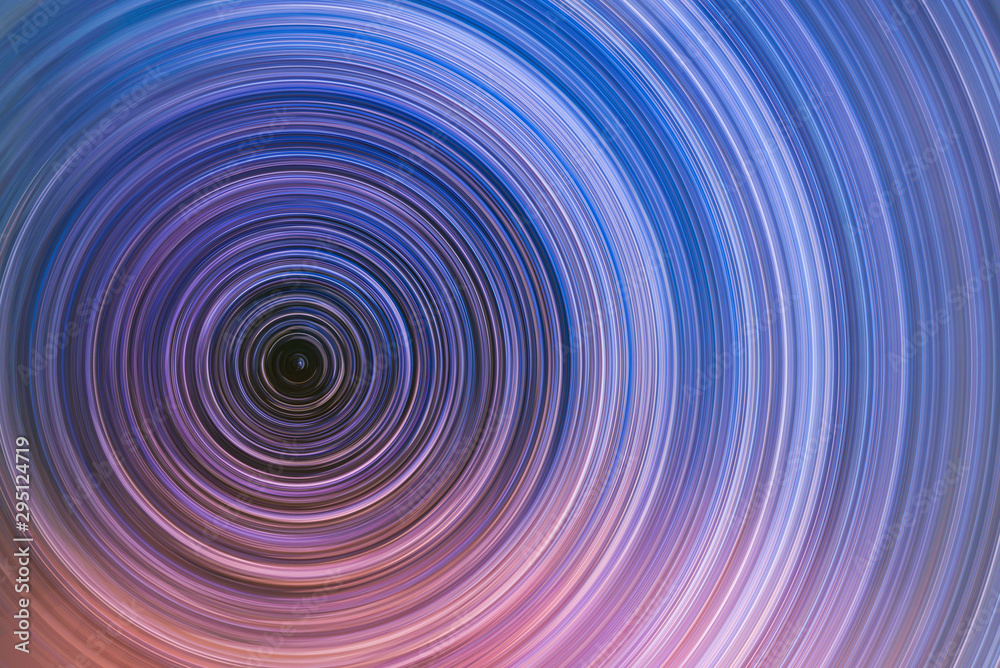 Beautiful starry sky with star trails orientation on the north star. Space background. Abstract long exposure background. Beautiful starry sky with star trails orientation on the north star. Space background. Abstract long exposure background.