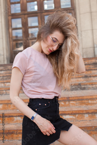 Young fashionable woman walking in the city