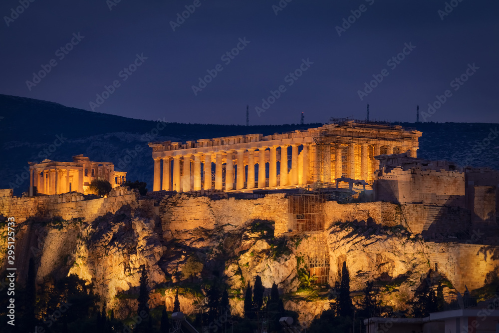 Parthenon and Herodium construction in Acropolis Hill in Athens, Greece shot in blue hour.