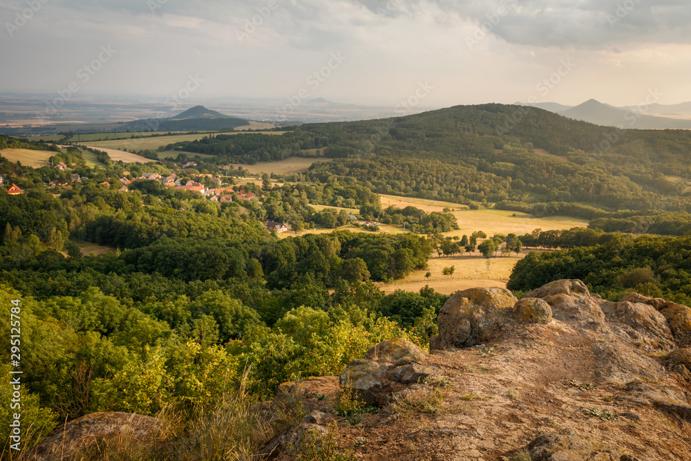 Summer sunset on the view point above the deep valley in Ceske stredohori mountains Lysa Hora, Czechia