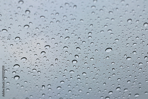 Pattern of water rain drops on window background