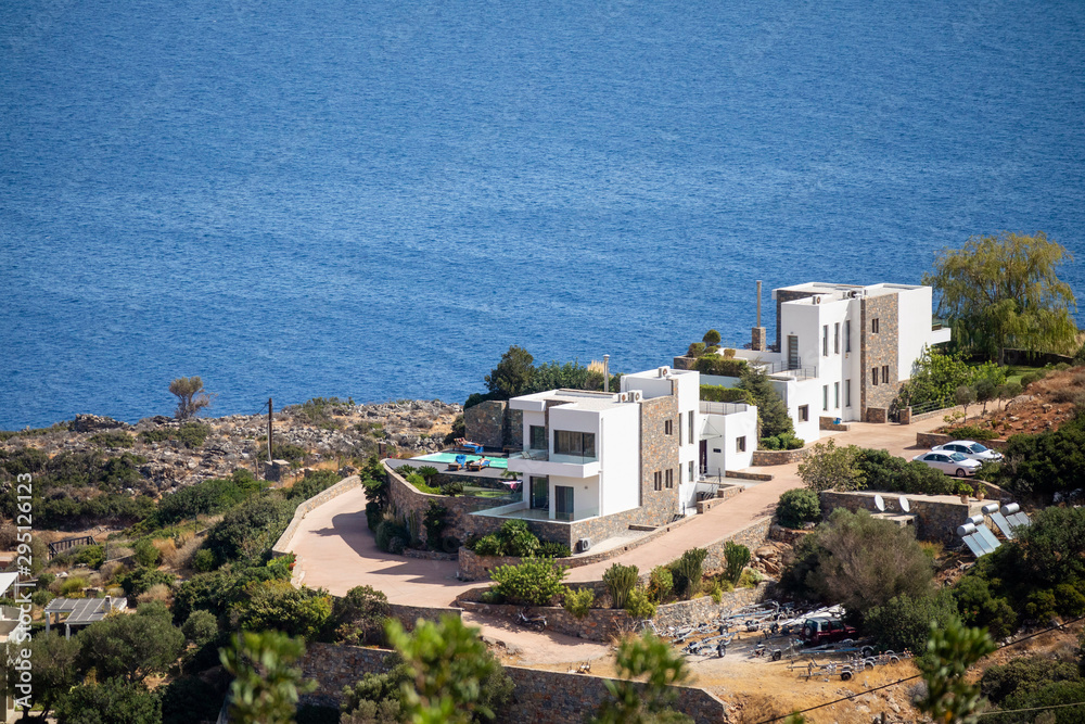 Elounda, Crete, Greece. October 2019. Holiday accommodation on the seafront at Elounda, eastern Crete.