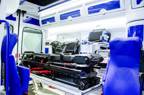 Inside an ambulance car with medical equipment.