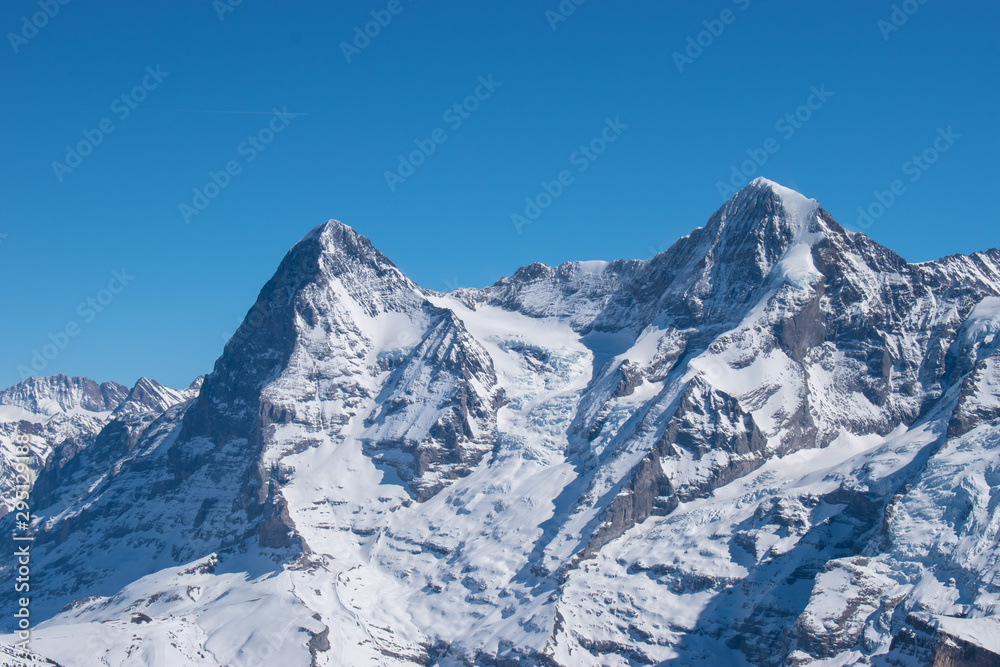 Swiss mountain peak after snowfall with panoramic view of Murren Jungfrau ski region.