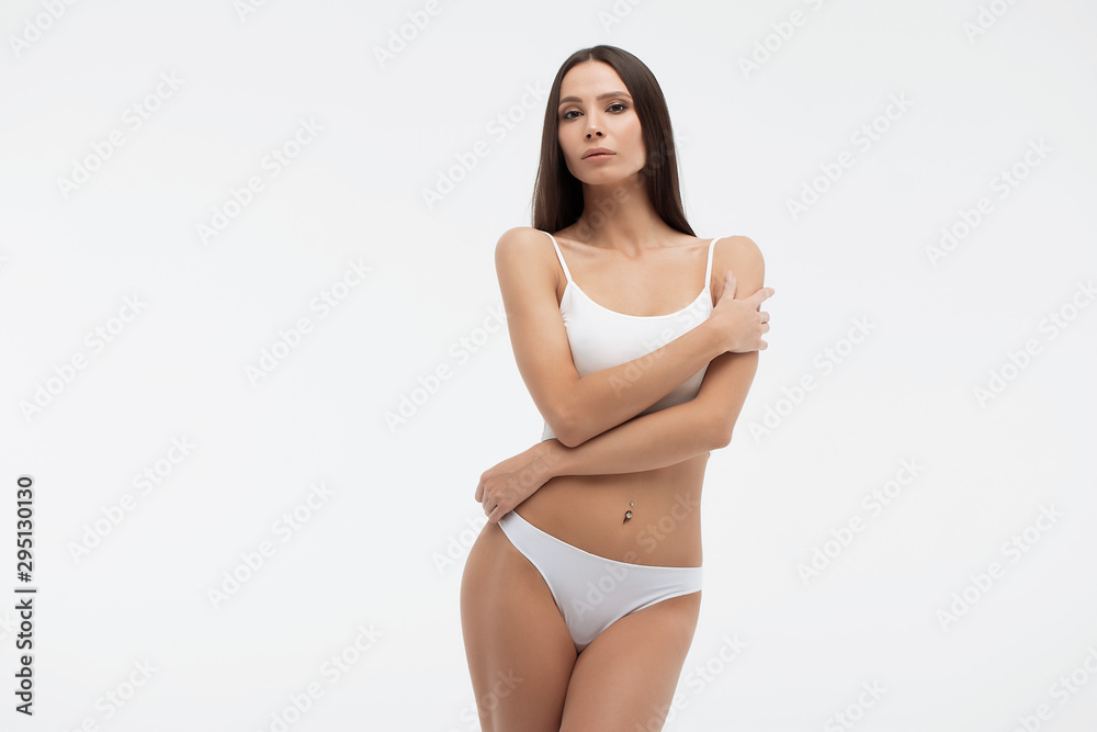 Sensual woman in underwear looking at camera alluringly - obrazy, fototapety, plakaty 