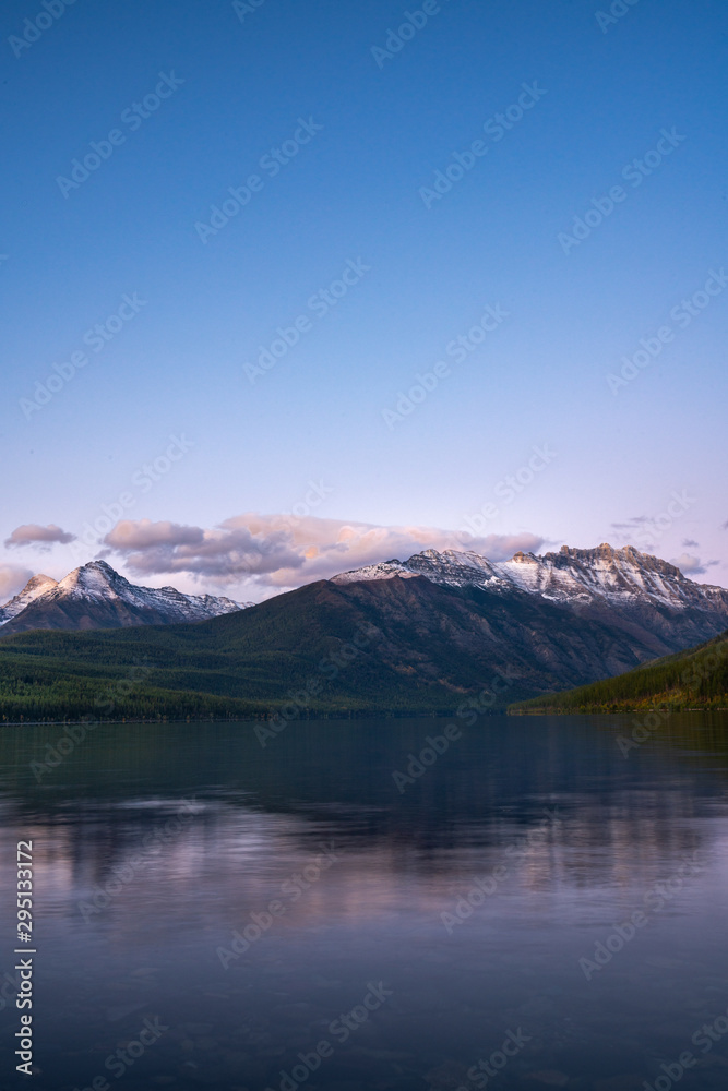The amazingly beautiful Kinkla Lake with the snow covered mountains in the background at Sunset, Glacier Park, Montana.