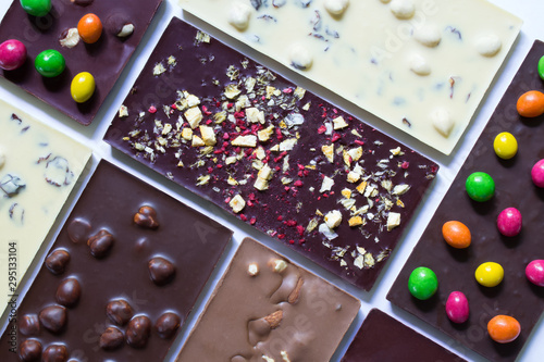 White and dark chocolate with nuts, goji, ginger and raisins. Handmade chocolate.