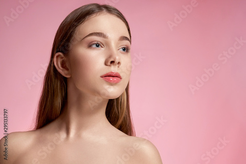 Young female without wrinkles and pimples posing