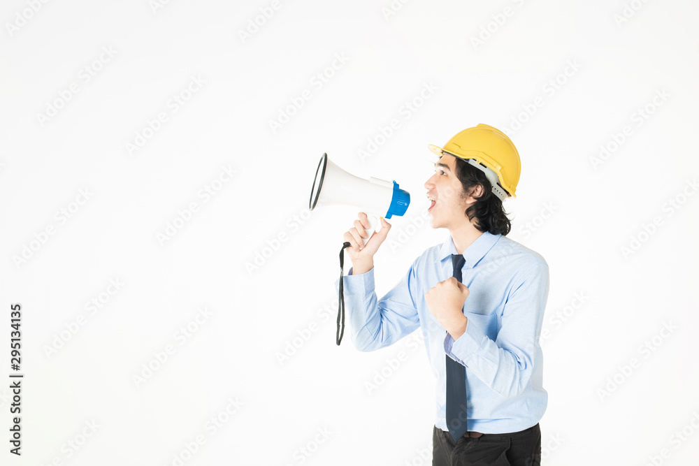 Young engineering man is announcing with megaphone