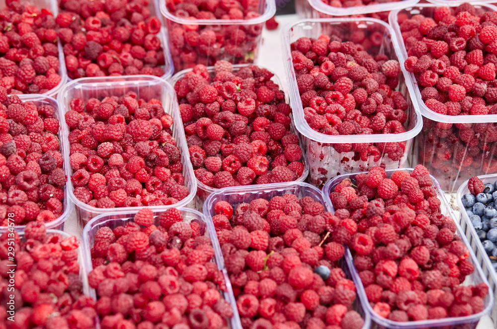 Boxes with raspberry from farmers market. Vitamin healthy food ready to eat Boxes with raspberry from farmers market. Vitamin healthy food ready to eat