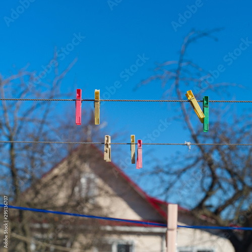 Colorful laundry pins on a rope