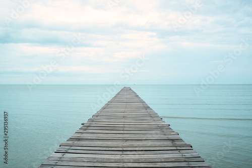 A wooden bridge that stretches out to the sea