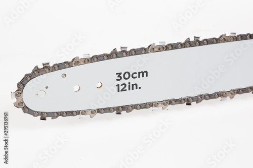 Valokuva Detail of chain bar on chain saw on white background