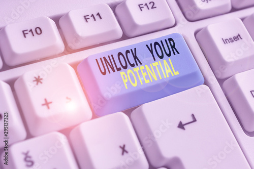 Text sign showing Unlock Your Potential. Business photo showcasing improve self awareness Skills to Achieve more White pc keyboard with empty note paper above white background key copy space photo