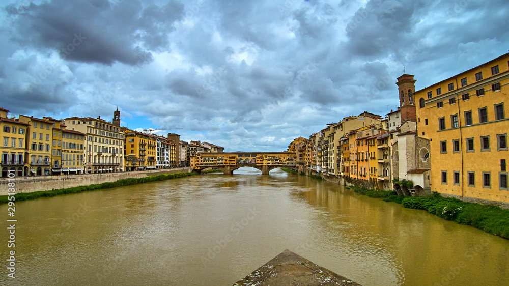 Ponte Vecchio bridge across Arno river in Florence, Italy. View from Ponte Santa Trinita