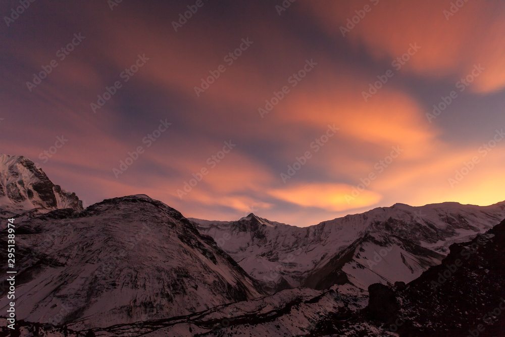 Pink clouds over the mountains. Beautiful sunset in the Himalayas, Nepal, Tilicho Base Camp