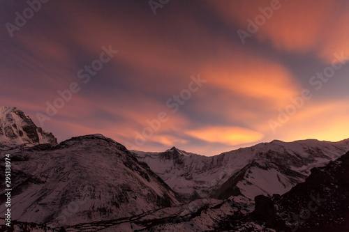 Pink clouds over the mountains. Beautiful sunset in the Himalayas  Nepal  Tilicho Base Camp