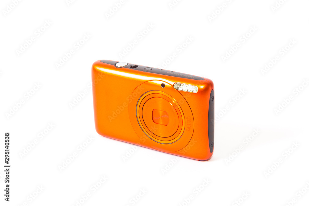 Bright orange compact camera in studio Bright orange compact camera in studio