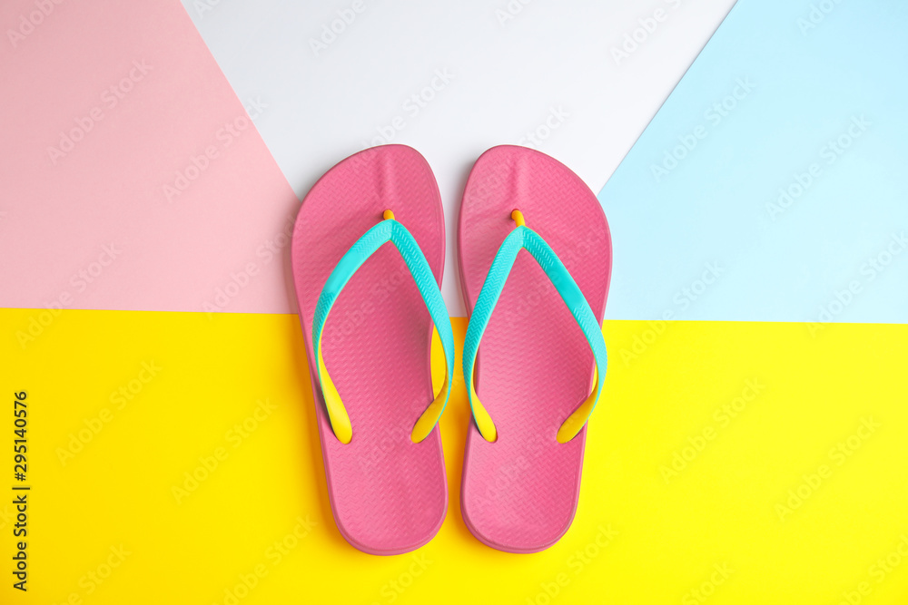 Flat lay composition with flip flops on color background. Beach objects Flat lay composition with flip flops on color background. Beach objects