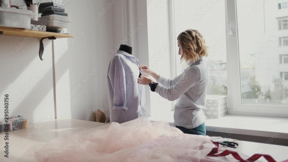 Young fashion designer, tailor and dressmaker customize clothes