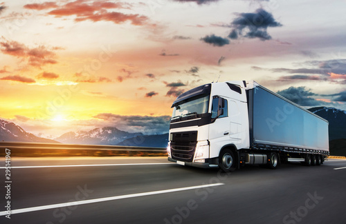 Canvas Print European truck vehicle with dramatic sunset light