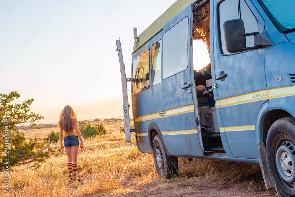 Woman and a camper van