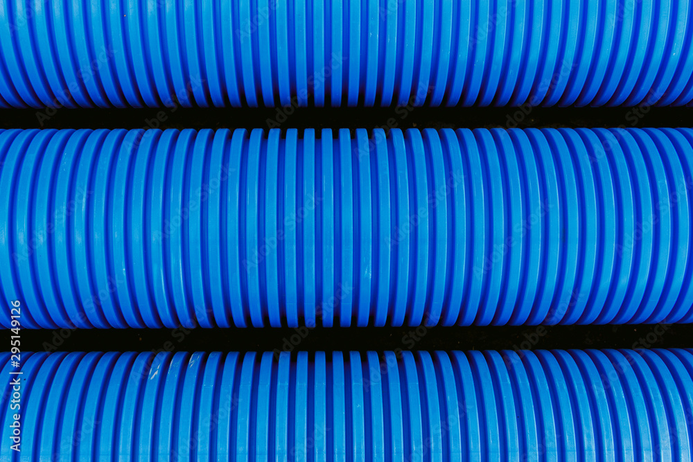 Blue plastic pipes used in the water supply system. Materials in the