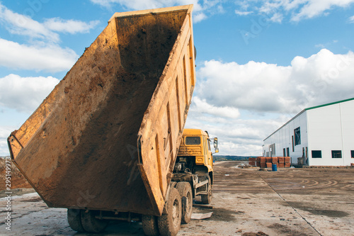 Old dump truck at a construction site. Equipment for construction.