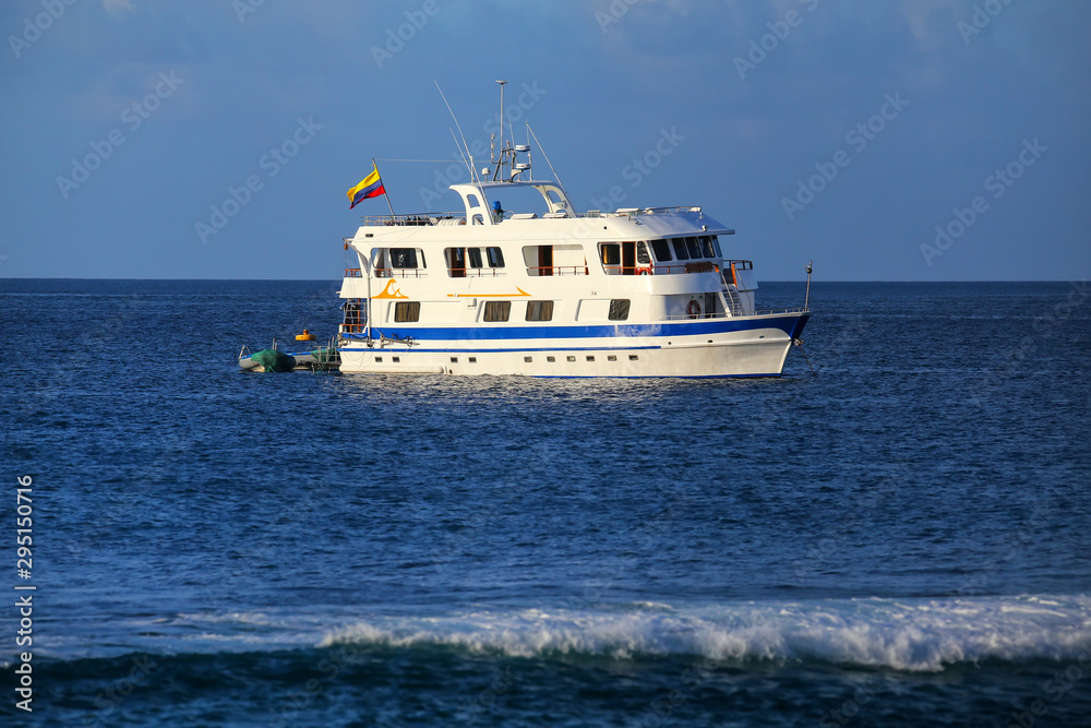 Typical tourist yacht anchored at Suarez Point at Espanola Island, Galapagos National park, Ecuador