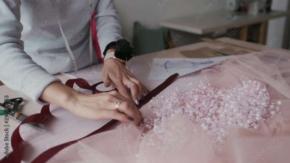 Young fashion designer, tailor and dressmaker customize clothes