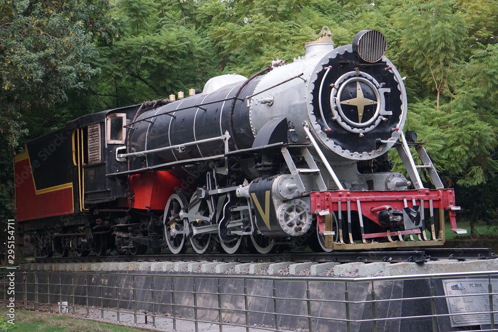 Naklejka premium the Vintage Steam rail engine situated in a public park for show