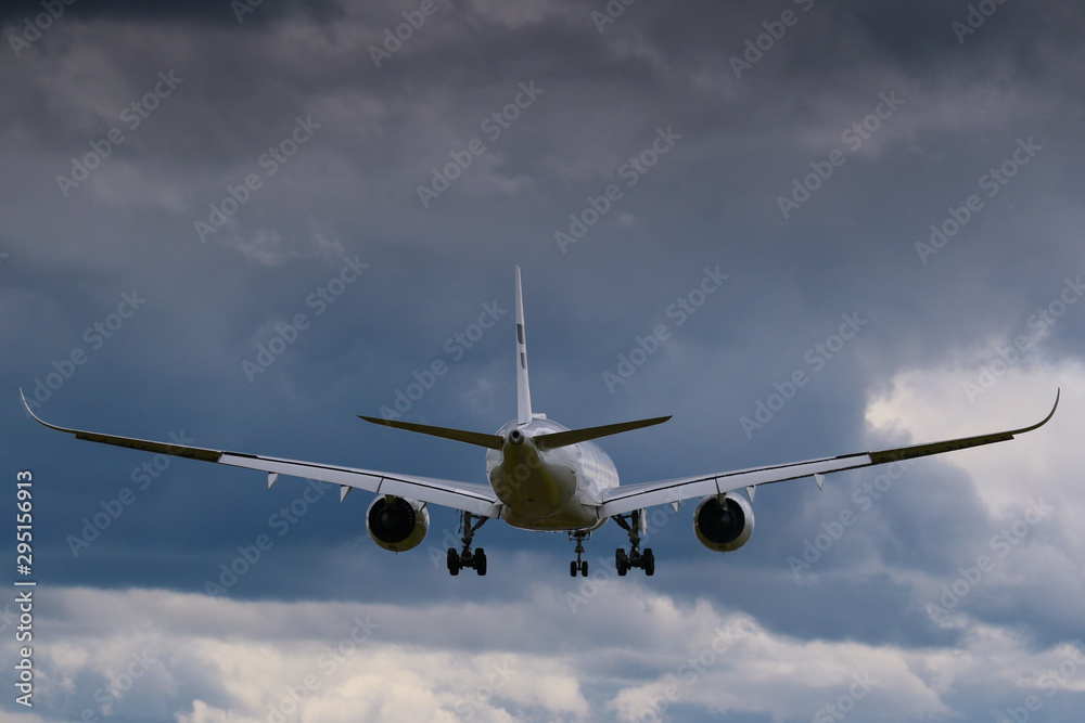 Flying airplane from behind