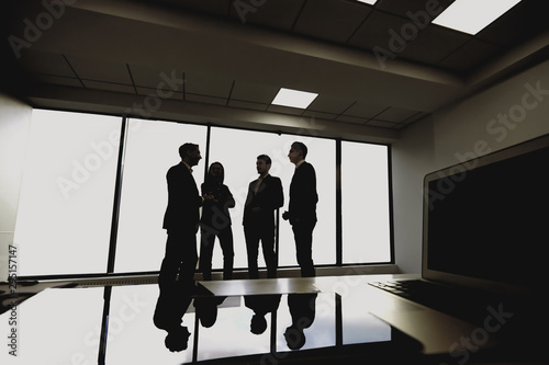 Silhouette of young business people in the office.