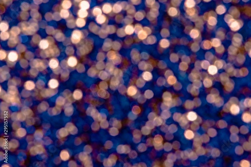 Beautiful colorful festive blurred background for christmas design, copy space. Unique midnight blue and pinky gold color backdrop for new year celebration 