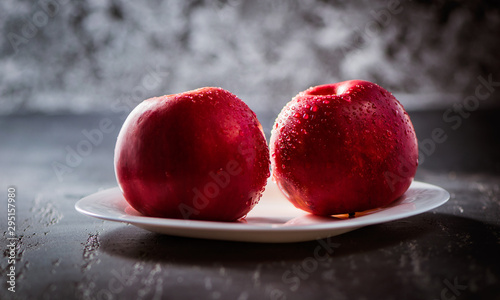 Apples red. Close-up of an apple. Water spray droplets.