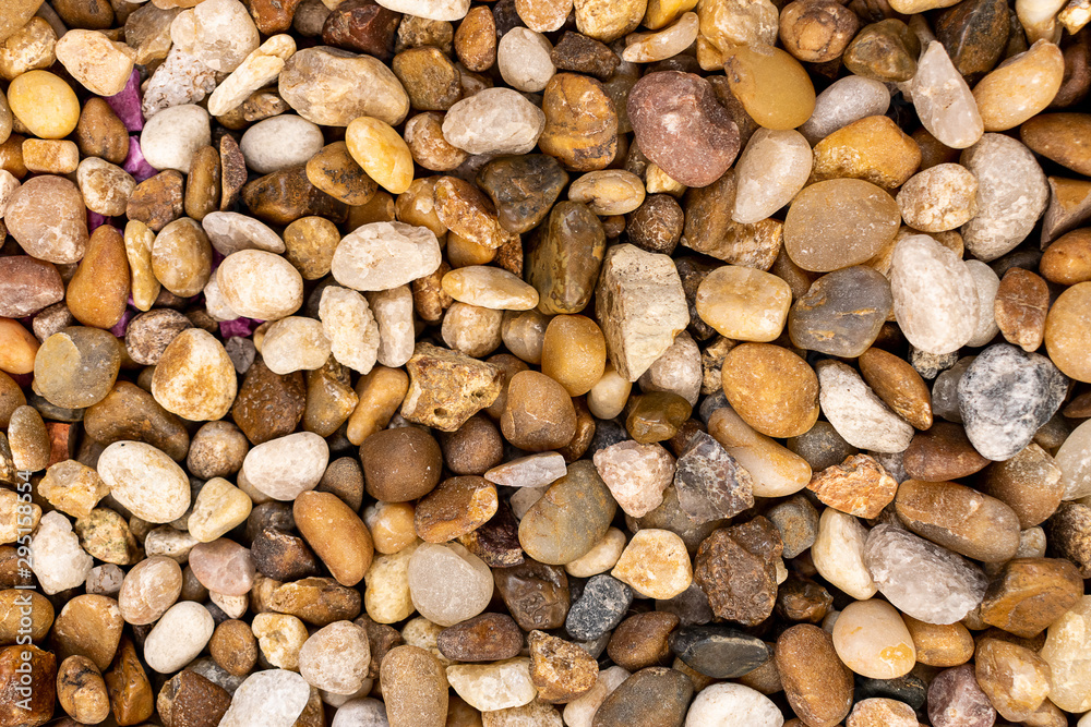 Small rocks, stones and pebbles closeup macro full frame texture Small rocks, stones and pebbles closeup macro full frame texture